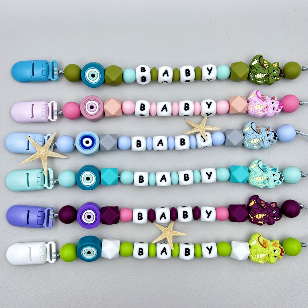 مخصص الإنجليزية الروسية سيليكو - مراجعة Baby Pacifier Clip وسعره